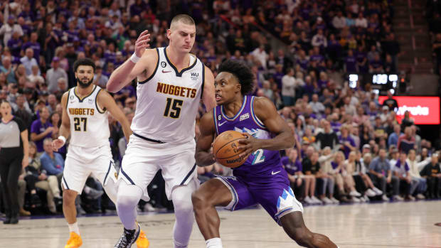 Utah Jazz guard Collin Sexton (2) tries to get past Denver Nuggets center Nikola Jokic (15) and to the basket during the second half at Vivint Arena.